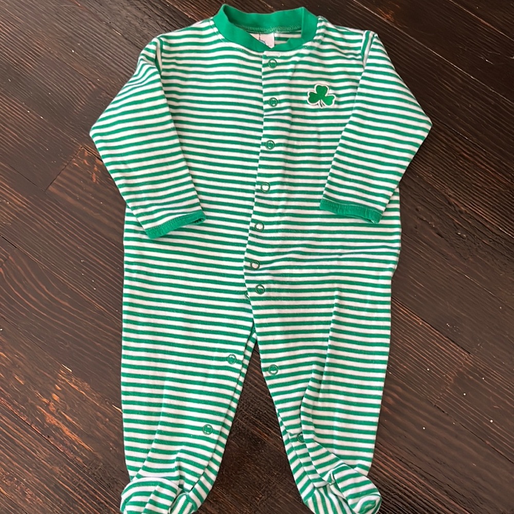 Green and white stripe long sleeved button snap onesie with Irish shamrock patch